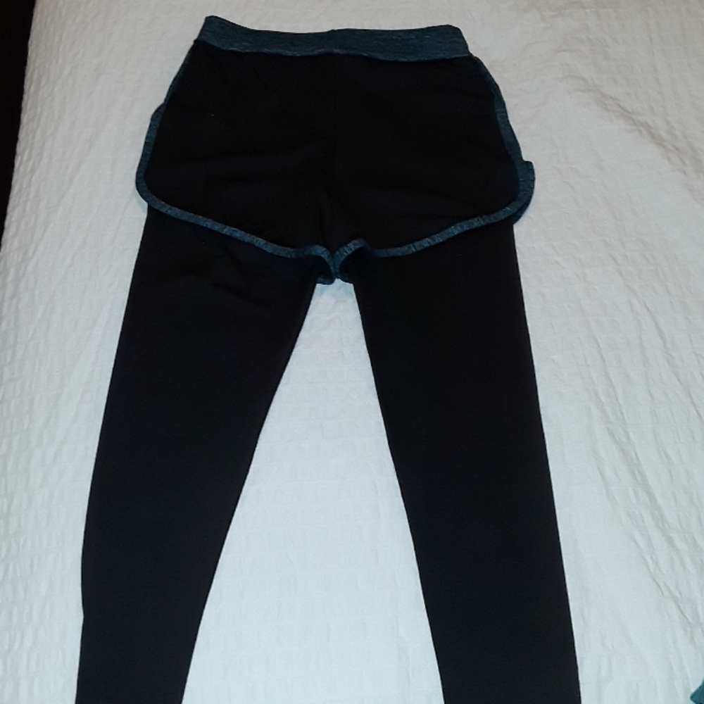 Black leggings with black shorts and blue lining